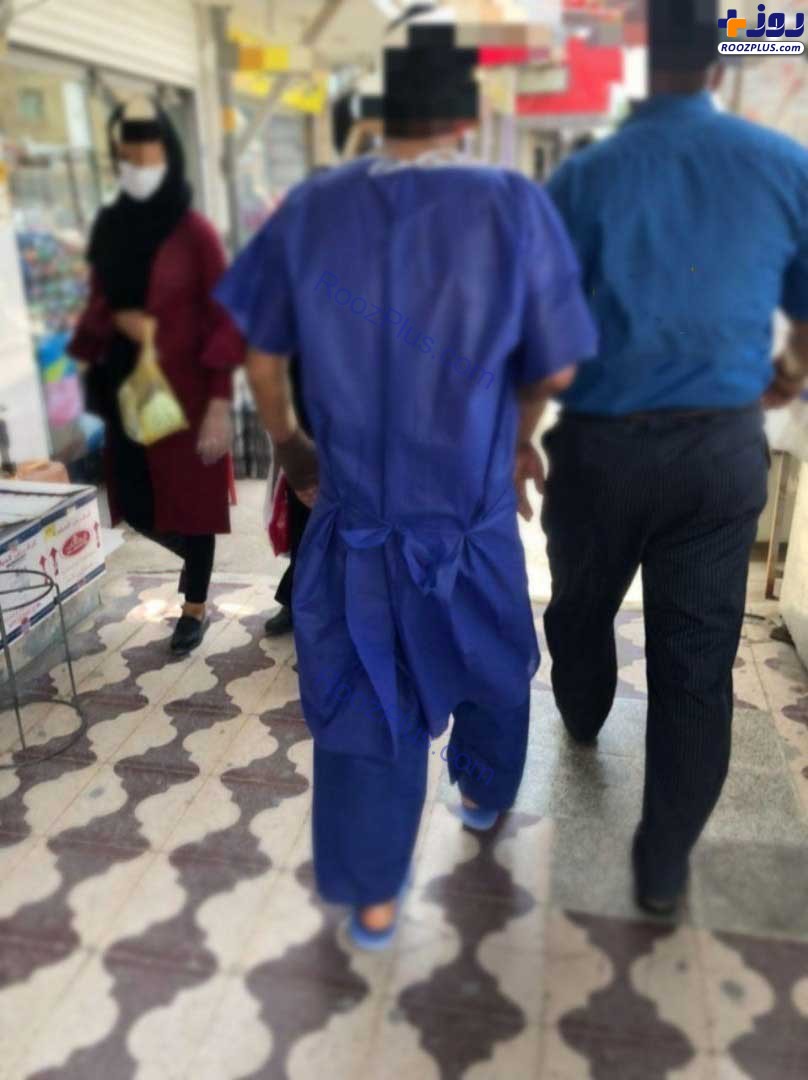 خرید کردن یک مرد در لباس بیمار بیمارستانی در بازار گناوه! + عکس