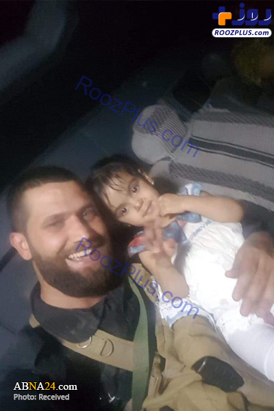 نجات یک دختربچه از دست داعش توسط نیروهای الحشد الشعبی/عکس